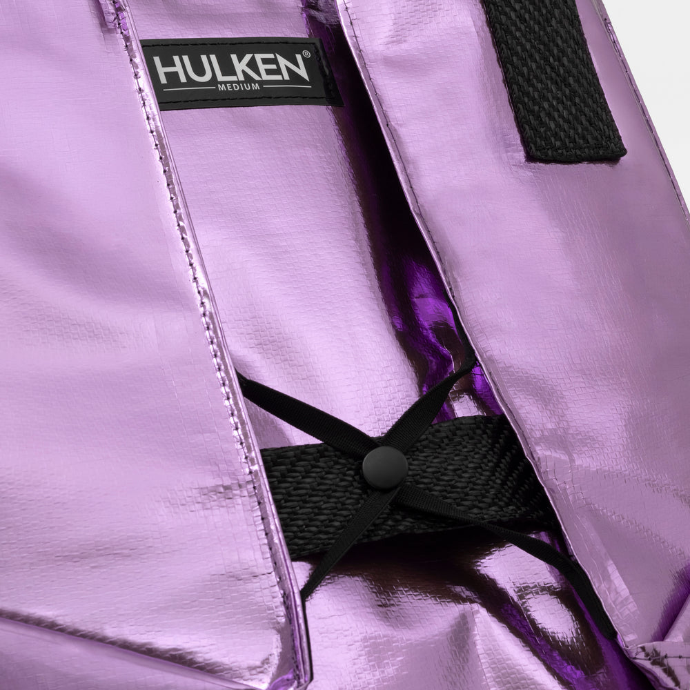 Close-up of a lilac bag with a 'Hulken' label on a white background