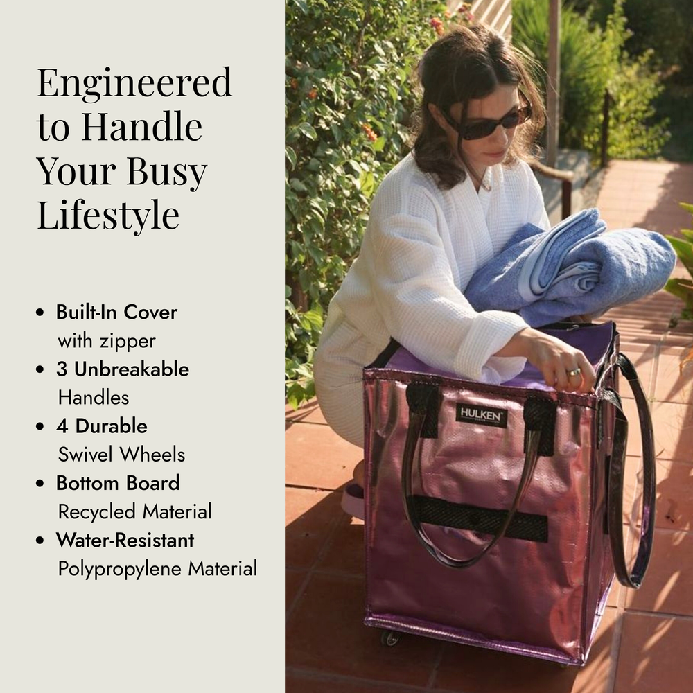 Woman with a pink rolling bag outdoors,