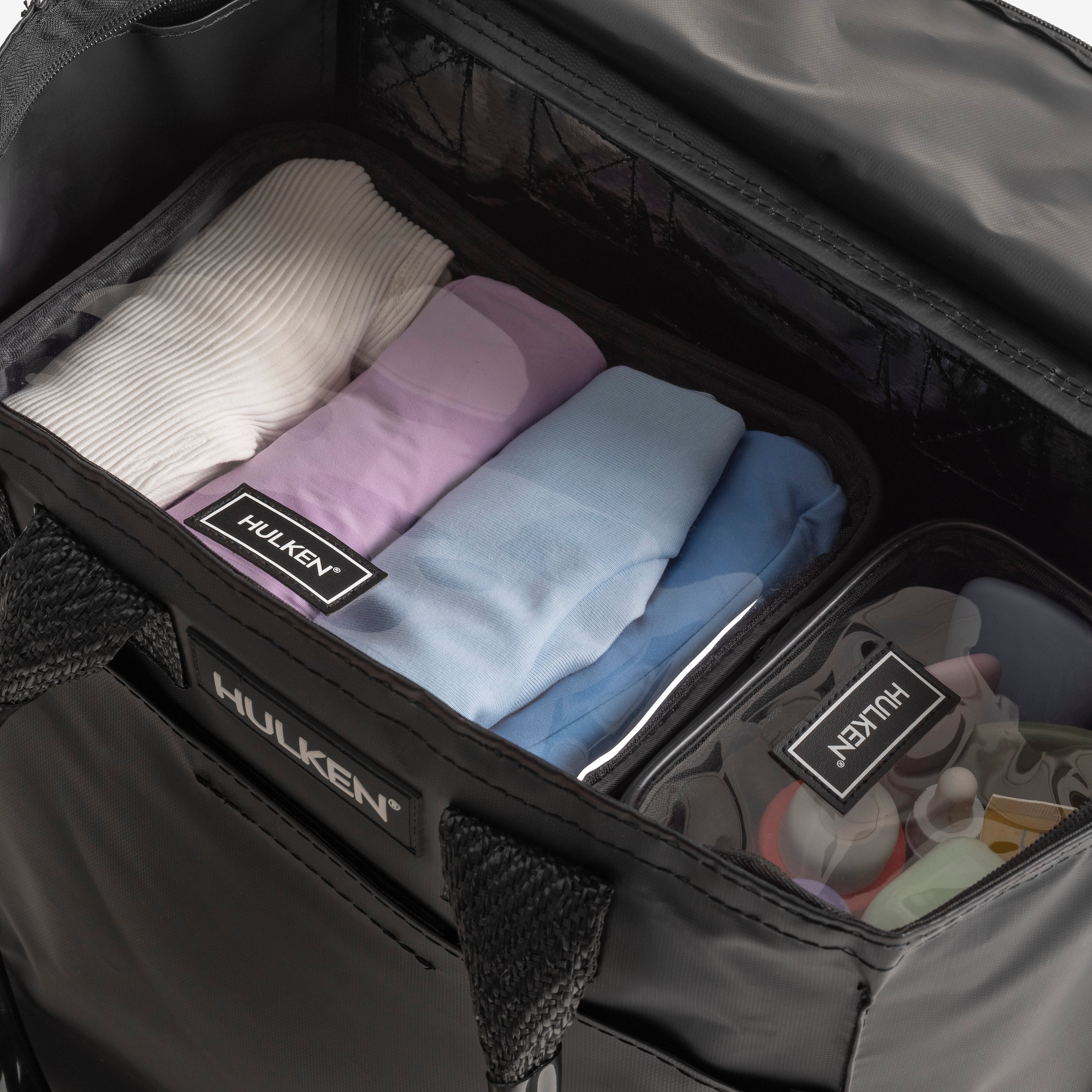 Black packing set with clothes and HULKEN branding