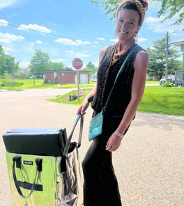 A lady with a silver tote bag