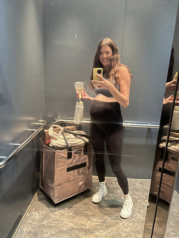A lady with a rose gold tote